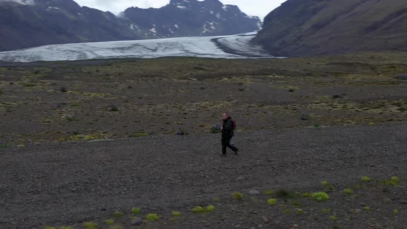 Man in Iceland Drone Circeling near Glacier