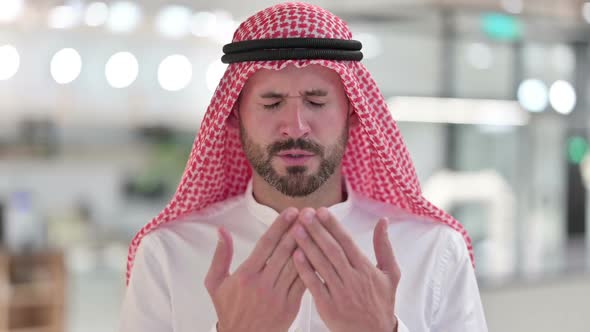 Religious Arab Businessman Praying to God