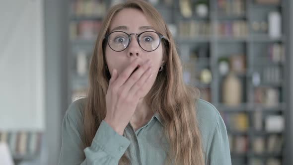 Portrait of Shocked Woman Getting Surprised in Office