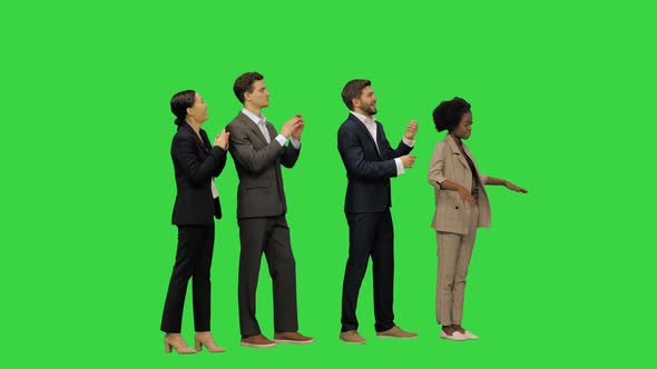 A Group of Business People Listening to Some Announcement on a Green Screen Chroma Key