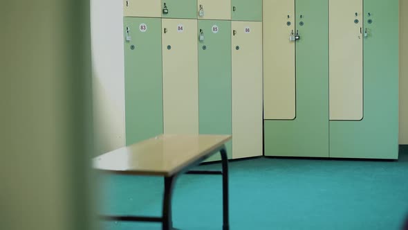 Young Girl-athlete in the Locker Room of the Gym, Unbuttoned, Sweatshirt