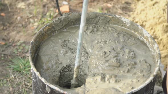 Mixing Mortar From Cement, Water and Sand