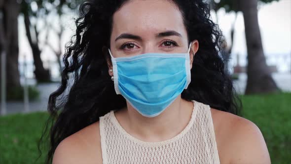 Portrait of a Young Student Woman Wearing a Protective Mask on the Street, Wearing a Ovid-19 Mask