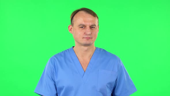 Medical Man Flirts, Blows a Kiss and Winks. Green Screen