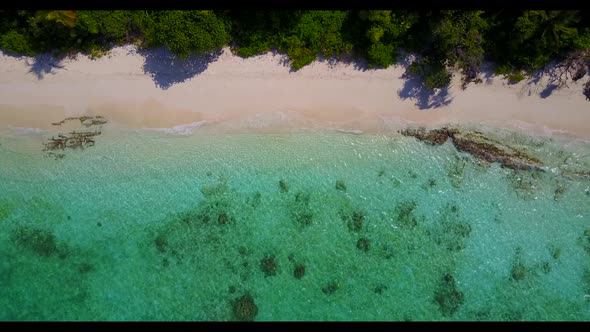 Aerial texture of beautiful resort beach vacation by blue ocean with white sandy background of journ