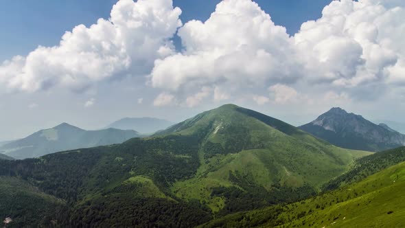 Beautiful Fast Clouds over Green Alpine Mountains Landscape in Sunny Summer Nature