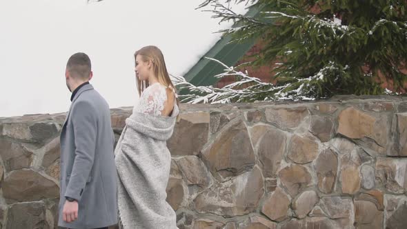 Couple Walking Down the Street