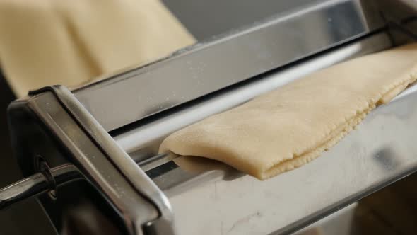 Italian lasagna making  from dough 4K 2160p 30fps UltraHD footage - Close-up of manual pasta machine