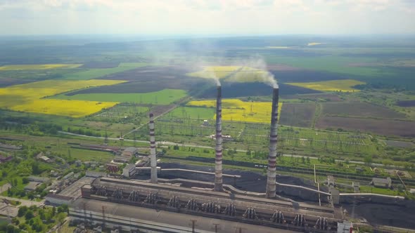 Chimneys of a Thermal Power Plant. Shooting From the Height of an Energy Object Running on Fossil