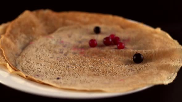 Pouring Maple Syrup On Delicious Pancakes With Blueberries. Crepes With Maple Syrup And Fruits.