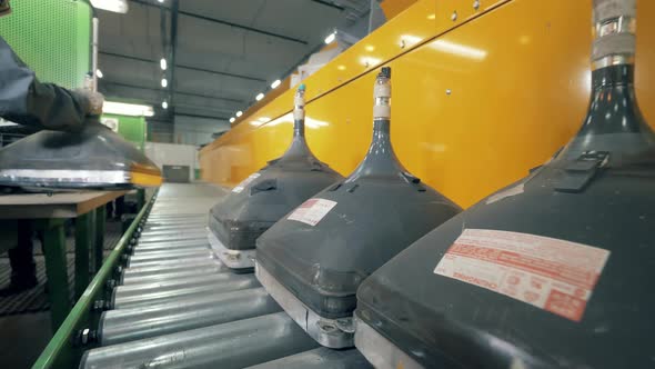 Conveyor Belt with Old Television Tubes Moving Along It