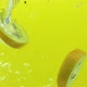 slices of kiwi fruit splash into water in slow motion - VideoHive Item for Sale