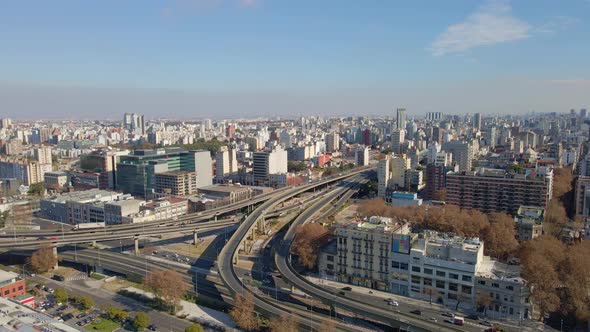 Aerial view of a intersection of Paseo del Bajo and Buenos Aires-La Plata highways at daytime with s