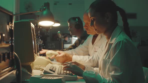 Vintage sci-fi scientists working in a operation room