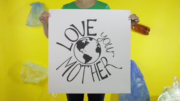 Unrecognizable Woman Holding Protesting Poster Love Your Mother Earth. Environment Plastic Pollution