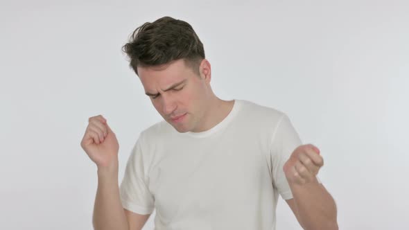 Enjoying Young Man Dancing on White Background