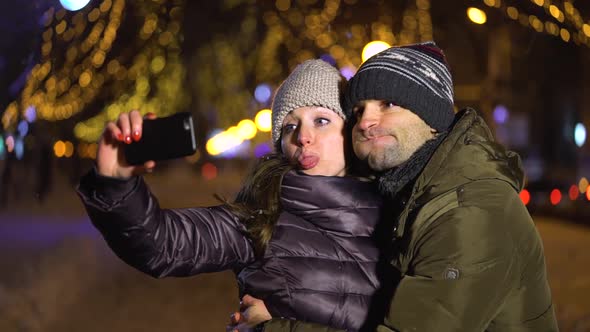 Happy Couple Taking a Picture of Themselves