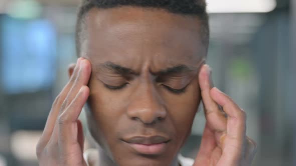 Close up of African Man having Headache