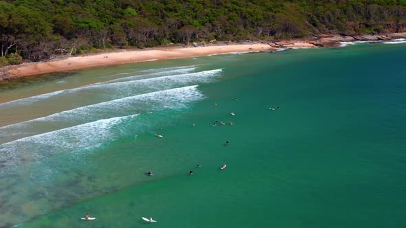 Aerial Drone View Of Surfers On Noosa Heads National Park In Queensland, Australia.