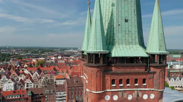 Slide and Pan Reveal of Medieval City Centre Behind St