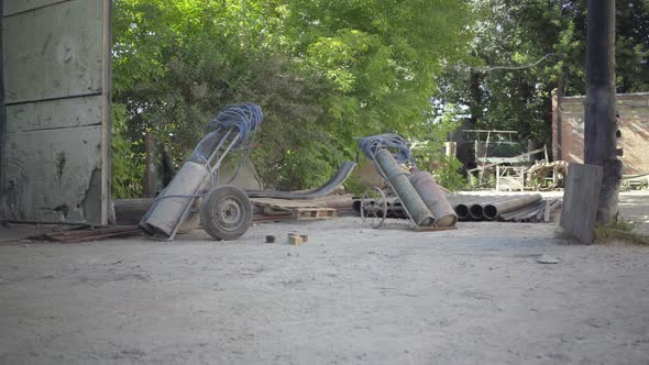 Camera Approaches To Gas Tanks Standing Outdoors on Sunny Production Site. Containers for Gas