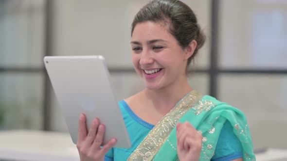 Portrait of Video Call on Tablet By Indian Woman in Office