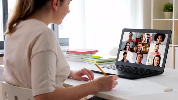 Woman with Laptop Drawing and Having Video Call