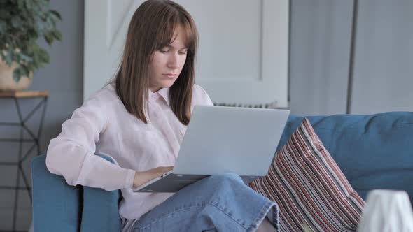 Casually Sitting Young Girl Working On Laptop