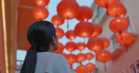 Woman look at the red lantern at night