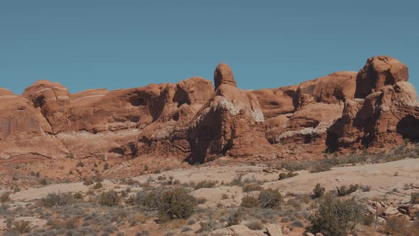 Red Orange Massive Smooth Rock Formation In Arches Park On Sunny Day In Motion