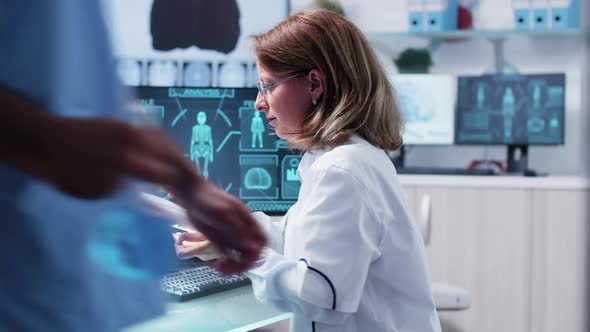 Female Scientist Uses a Magnifying Glass in Modern Laboratory alt