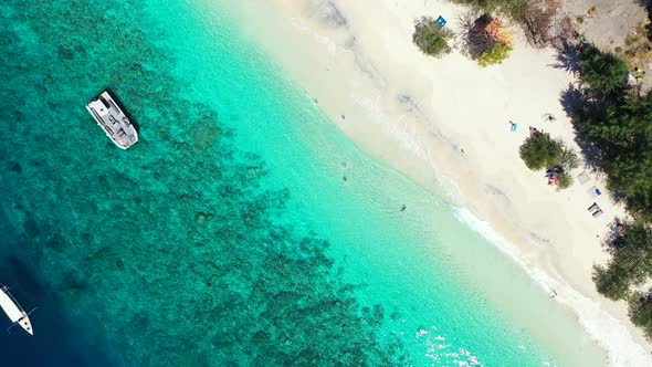 Luxury flying island view of a white paradise beach and aqua blue water background in high resolutio