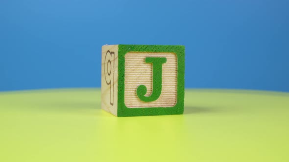 Close up shot letter "J" alphabet wooden block