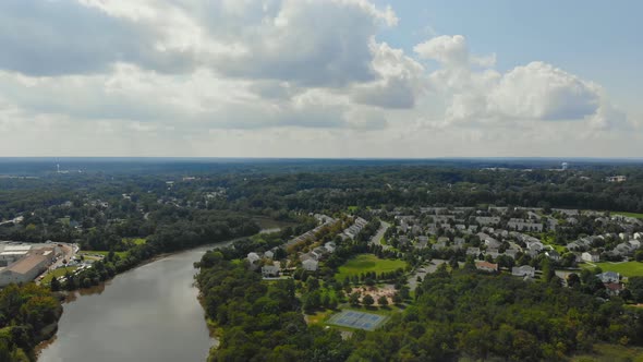 Aerial top view waterfront suburban street of middle class suburban