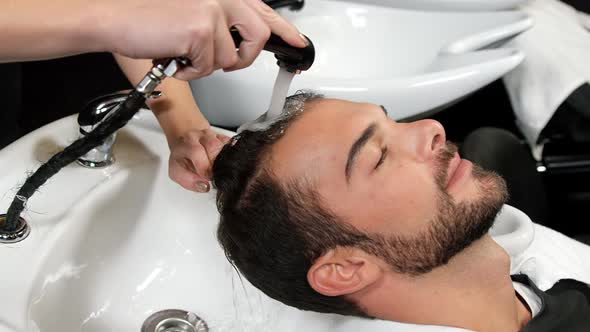 Man getting her hair wash