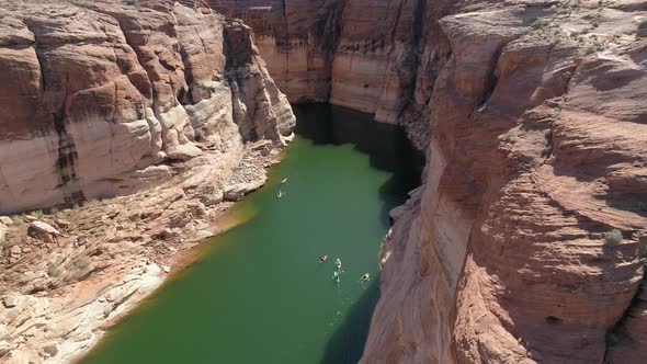 Aerial view of people kayaking in the canyon alt