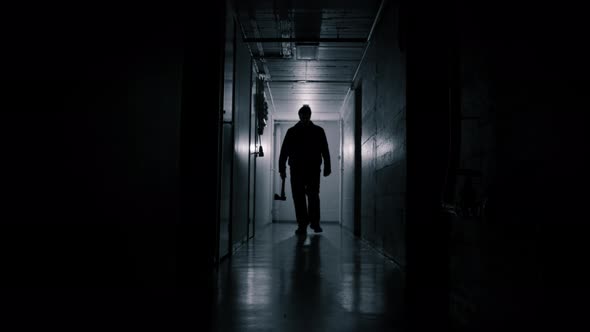 Ax Murderer Walking Down Creepy Hallway