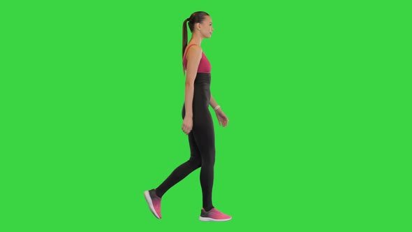 Happy Healthy Sporty Girl Walking on a Green Screen Chroma Key