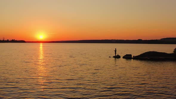 People fishing at sunset