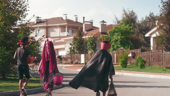 Kids in Halloween Costumes Trick-or-Treating