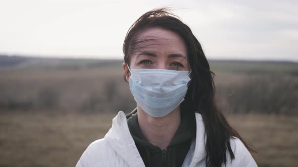 Girl with Medical Mask To Protect Her From Virus. Pandemic Coronavirus Concept