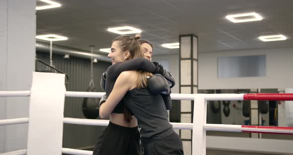 Two Girls in Boxing Gloves in the Boxing Ring