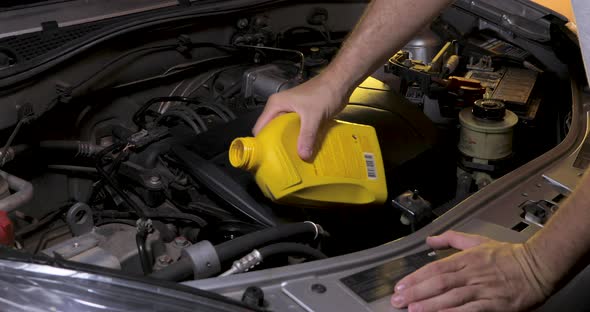 Completing the car engine oil, level is low