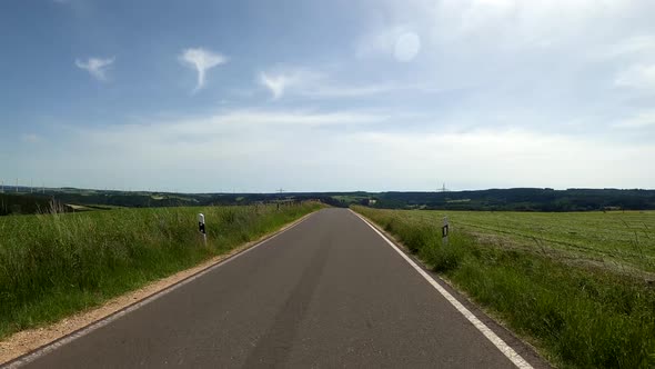 POV Driving on motorcycle on a scenic road in Eifel National Park in Germany