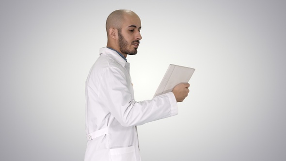 Sincere doctor making video call to his patient walking
