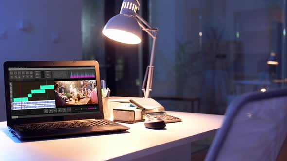 Video Editor Program on Laptop at Night Office 13