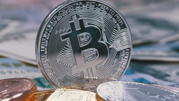 Silver Bitcoin Coin, BTC and Bills of Dollars Are Rotating