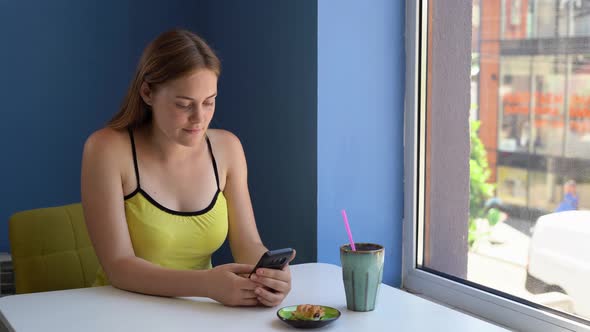 Beautiful Caucasian Woman Using Smartphone in Coffee Shop Happy Smiling