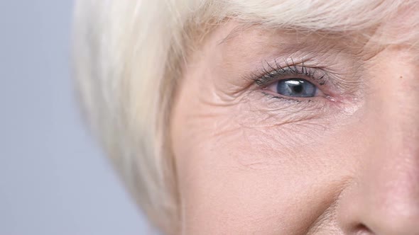 Mature Woman Smiling Into Camera