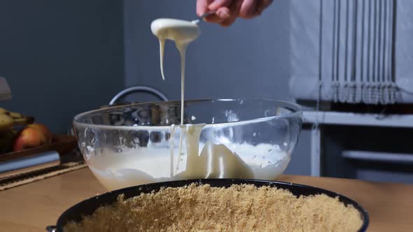 Woman Make Cheesecake With Cream